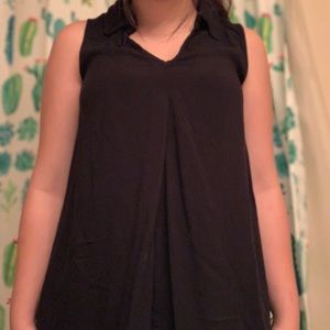 women’s sleeveless blouse with collar.